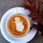 Coffee with ghost made of milk